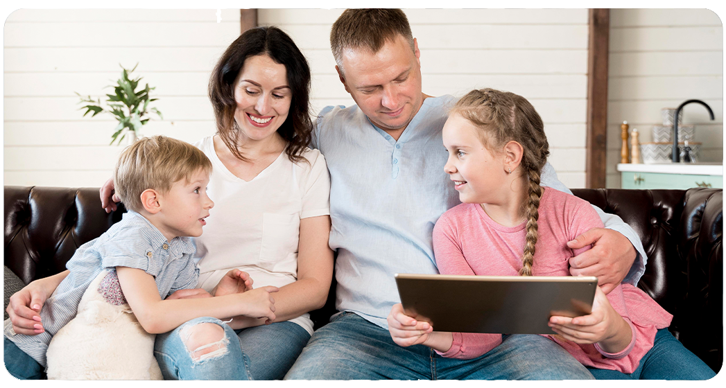 Family at home using smart devices, installed by Anchor Electric, a top electrician in Sarasota.