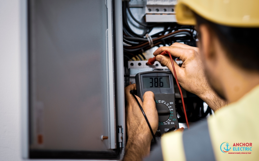 Electrician from Anchor Electric in Sarasota testing an electrical panel with a digital multimeter.