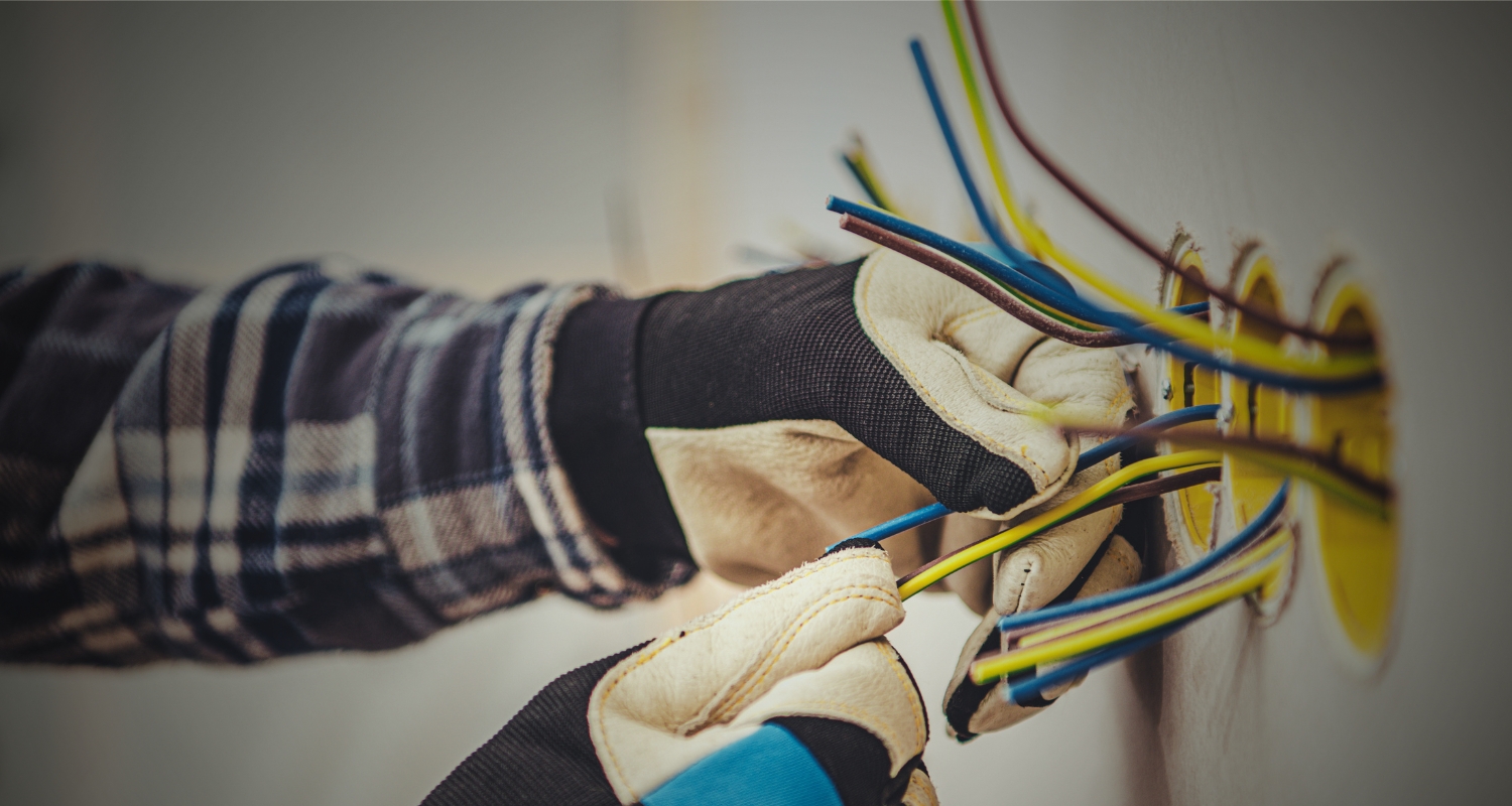 Anchor Electric technician installing residential wiring and outlet boxes for a home renovation in Sarasota