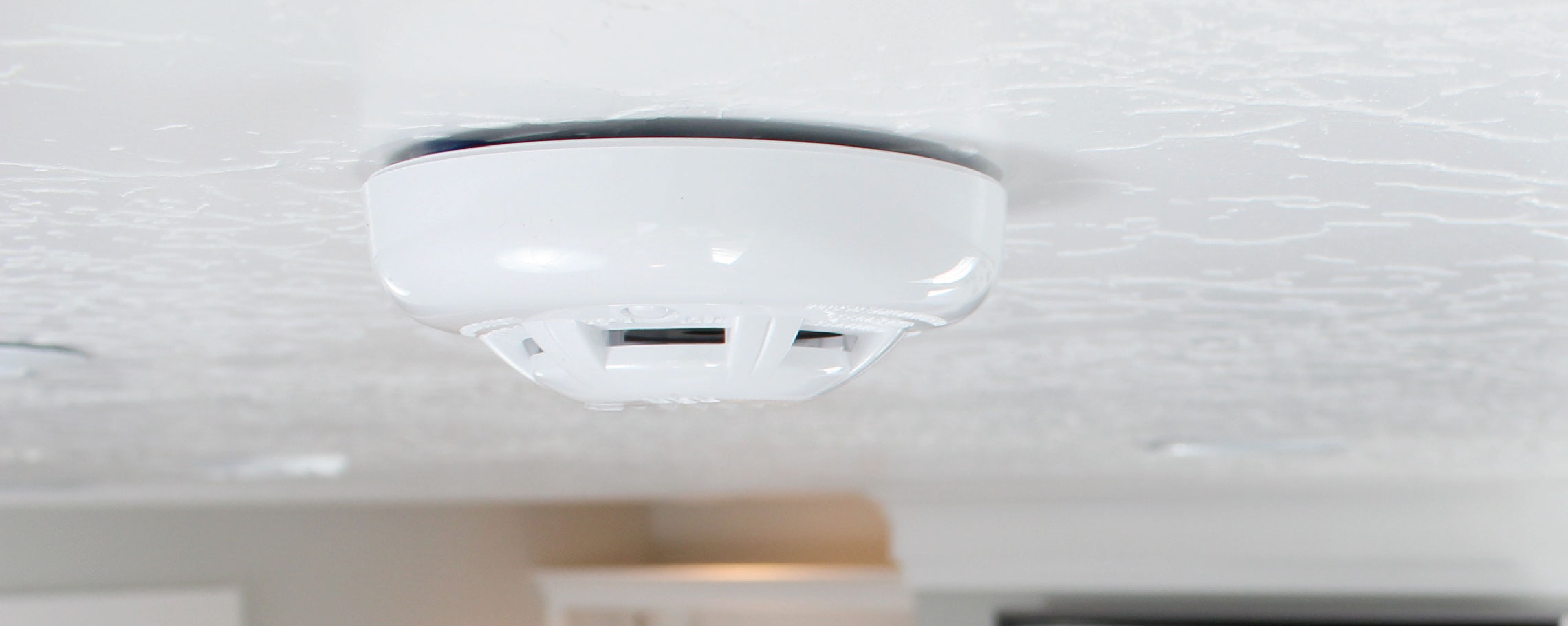 Anchor Electric ceiling-mounted commercial smoke detector installation by certified electrician in Sarasota Florida
