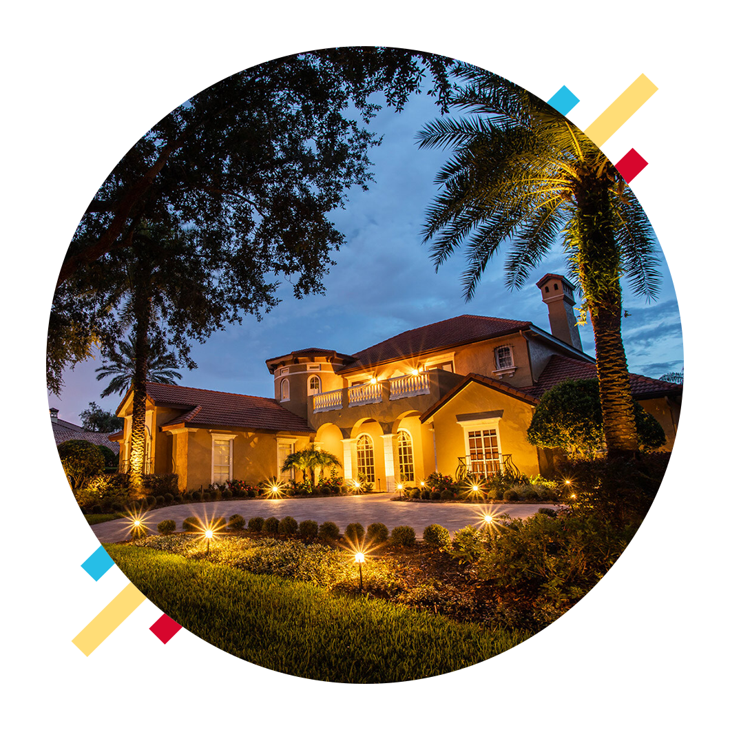 Luxury Sarasota home showcasing professional architectural uplighting and path lighting by Anchor Electric LLC.