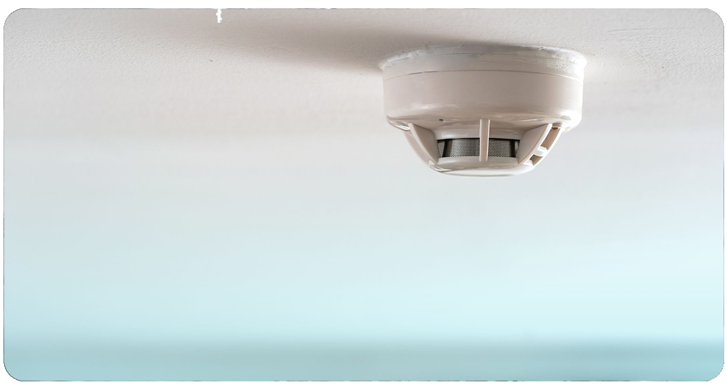 Commercial smoke detector installation on ceiling by Anchor Electric, a top Sarasota electrical contractor.