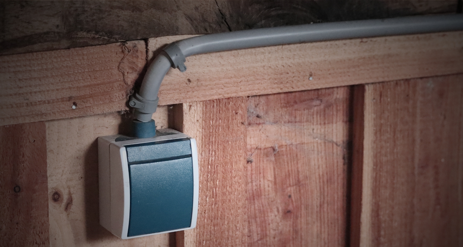 Surface mount electrical switch installation on a wood wall by Anchor Electric in Sarasota