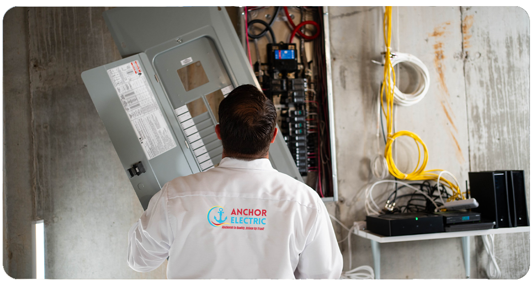 Licensed electrician from Anchor Electric installing a residential electrical panel upgrade in Sarasota, Florida